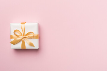 White gift box on color background, top view