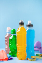 Different sport drinks in bottles - L-carnitine hydrolyzed collagen and isotonic. Fitness concept.