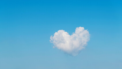 White heart shaped cloud in the blue sky