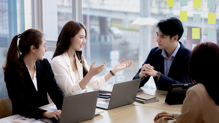 Meeting room atmosphere and business groups are meeting, discussing and planning business operations for more profitable growth. Concept of business meeting and company administration.