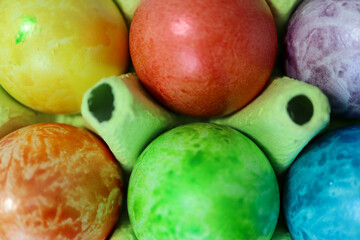colorful easter eggs in a egg carton box close up