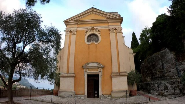DOLLY SLOW MOTION - The fa&ccedil;ade of the Church of Notre Dame de l'Assomption (Notre-Dame-de-l'Assomption) in Eze, France. A Baroque church nestled in the medieval village.