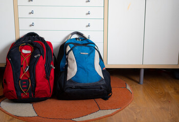 Two travel backpacks are on the floor. Refugees' belongings
