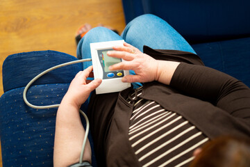 Women's health check blood pressure.and heart rate with digital manometer standard blood pressure...