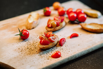 Italian aperetivo bruschettas bread with chopped tomato and basil 