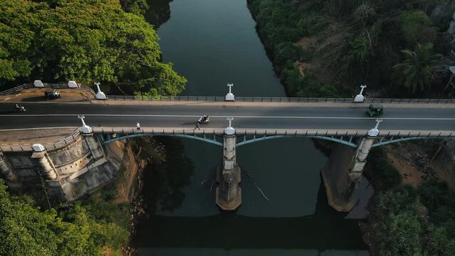Suspension Bridge in Peradeniya Botanical Garden  Kandy - Sri Lanka. Natural green landscape with tropical trees, Royal Botanical Gardens, Peradeniya.