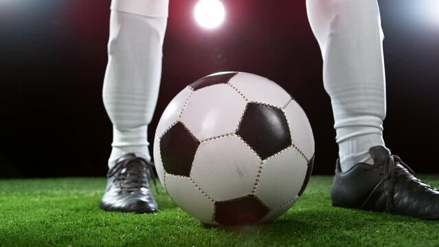 Close-up of Football Player Kicking Soccer Ball, Super Slow Motion at 1000 fps. Filmed on High Speed Cinematic Camera at 1000 fps.