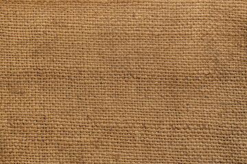 coarse woven fabric made from natural fibers, linen burlap texture in natural color