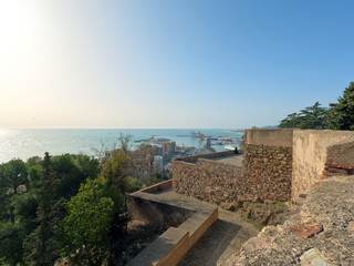 Fototapeta na wymiar Gibralfaro and Alcazaba ramparts overlooking Malaga city and the Mediterranean Sea, Spain, Europe