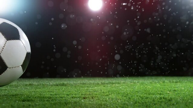 Close-up of Rolling Soccer Ball on Football Field, Rainy Weather. Super Slow Motion at 1000 fps. Filmed on High Speed Cinematic Camera at 1000 fps.