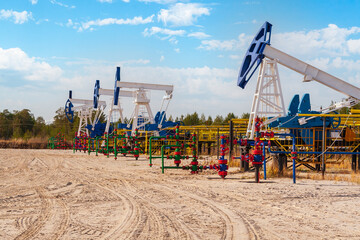 Oil and gas industry in Russia. Oil and gas field bush. Oil pumping chair in the fields of Siberia.