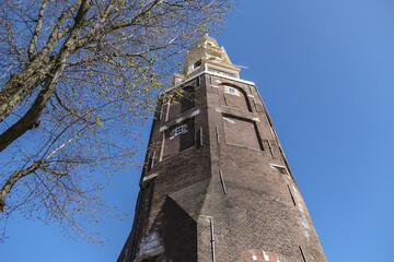 Montelbaanstoren - tower from 1516, located along Oudeshans canal in Amsterdam Centrum. Amsterdam,...