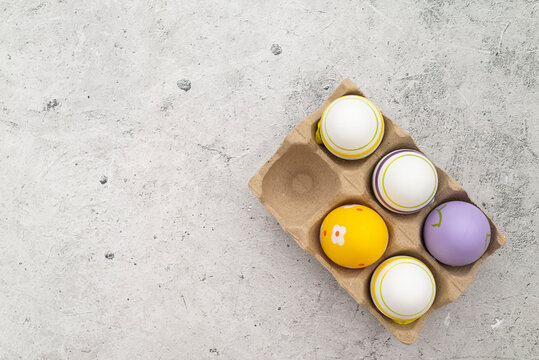 Colorful Easter eggs background on the concrete background.