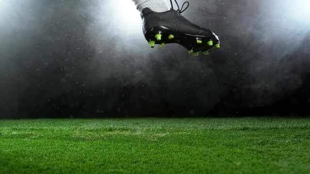 Super slow motion of soccer player kicking the ball. Filmed on high speed cinema camera, 1000fps. Speed ramp effect.