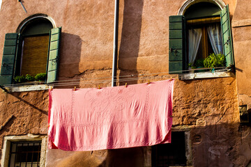 Venice, laundry in front of old wall