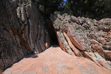 Entrance to a narrow cave in the mountains