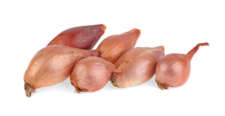 Unpeeled small brown onions on white background