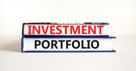 Investment portfolio symbol. Books with concept words Investment portfolio on beautiful white background. Business investment portfolio concept. Copy space.