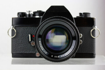 A vintage analog photo camera from the 70s for 35mm film with 50mm manual focusing mechanical lens...