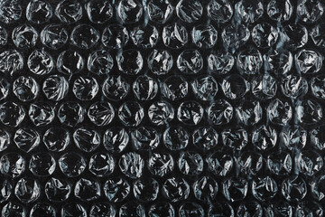 The texture of the packaging air-bubble film on a Black background in full screen