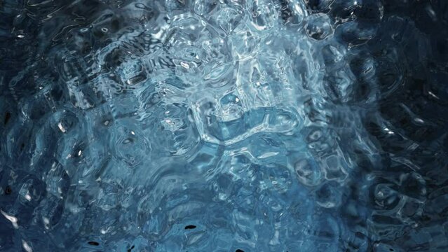 Super slow motion of water surface on dark blue background. Filmed on high speed cinema camera, 1000 fps.