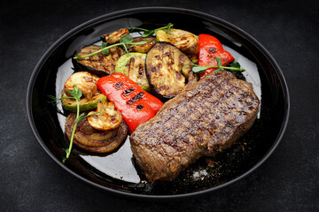 Juicy steak and grilled vegetables, with spices