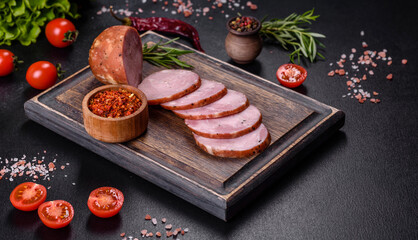Delicious fresh ham cut with slices on a wooden cutting board
