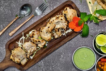 Chicken malai tikka is a popular chicken kebab & kabab made by using boneless chicken pieces in a creamy cashew-nuts based marination. Malai kabab is a creamy kebab with a distinct favour of cardamom