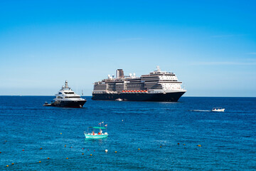 Luxury cruise ship sailing into port.