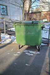 plastic trash can on the street on a sunny morning