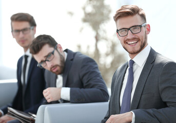 businessman and a group of colleagues waiting for the start of a business meeting