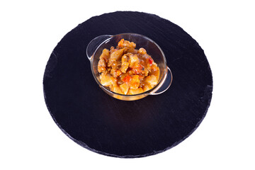 portion of meat stew with potatoes in a glass plate