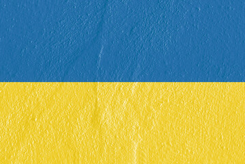 National Yellow and Blue Flag of Ukraine painted on beautiful textured concrete wall. Copy space. Symbol of the country