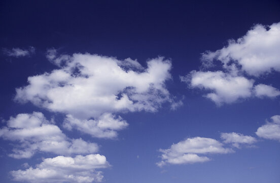 Clouds in a blue sky - Powered by Adobe