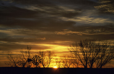 Silhouette of a wind turbine during sunset, Barber, Kansas, USA