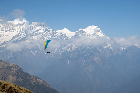 Paraglider with Annapurna mountain range in the background.