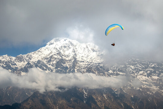 A man paragliding, Annapurna region, Himalayas near Pokhara, Nepal 