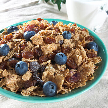 High angle view of corn flakes with blueberries in a bowl