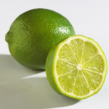 Close-up of two limes