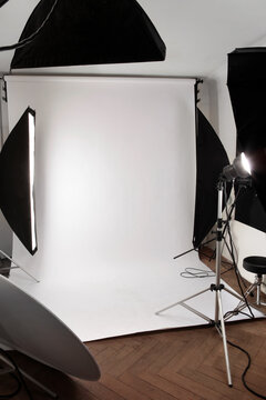 A small photostudio with white paper background