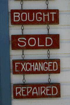 Signs suspended from chains