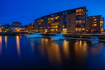 Evening view of marina near Blomsterbrua (Flower Bridge) in Solsiden - one of Trondheim's most popular areas with shops and restaurants. Norway