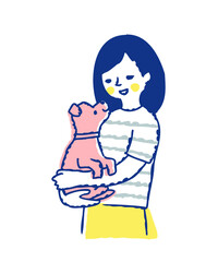 子犬を抱っこしている笑顔の女性