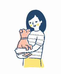 子犬を抱っこしている笑顔の女性