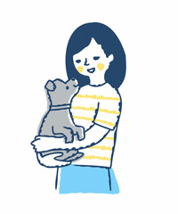 子犬を抱っこしている笑顔の女性