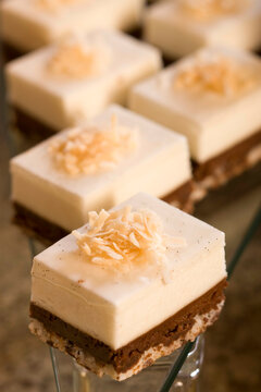 Close-up of cheese fudge brownies garnished with coconut