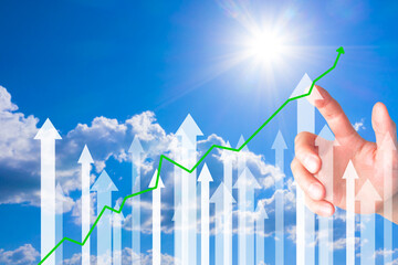Close up of businessman hand pointing at abstract glowing growth chart and arrow on blurry Sky...