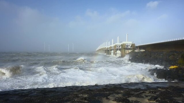 Waves crashing during storm Eunice, Vrouwenpolder, Netherlands