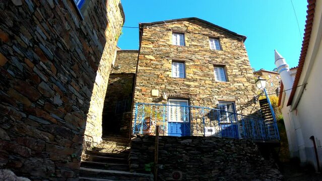 DOLLY SLOW MOTION SHOT - The picturesque little schist village of Piod&atilde;o clings to a steeply terraced mountainside deep within the foothills of the Serra de A&ccedil;or range in central Portugal.
