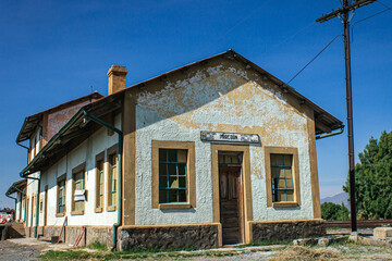 Old railway station on side with blue sky